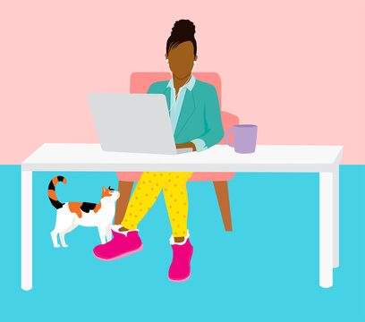 Work from home concept - woman in home office working on laptop looking professional on top and casual pajamas below