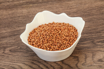 Raw buсkwheat cereal in the bowl