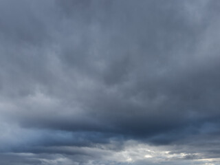 Cloudy pre-stormy sky as a background. Dramatic heaven.
