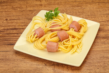 Kids pasta spaghetti with sausages