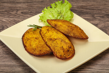 Baked potato with herbs and spices