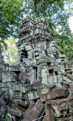 Fototapeta na wymiar Buildings Details and Rubble at the Ruins of Ta Prohm Temple at Angkor Wat Siem Reap Cambodia
