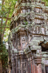Fototapeta na wymiar Buildings Details and Rubble at the Ruins of Ta Prohm Temple at Angkor Wat Siem Reap Cambodia