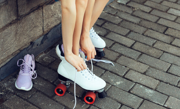 Girl putting on roller skates