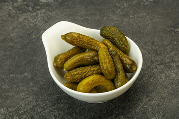 Pickled gherkin in the bowl