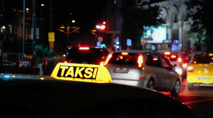 Illuminated taxi sign in traffic in Istanbul