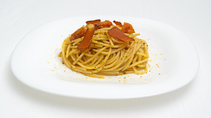 spaghetti with mullet fish and tomato on the plate