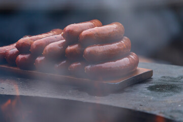 Delicious sausages on the grill for sale.