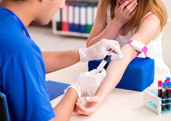 Young patient during blood test sampling procedure
