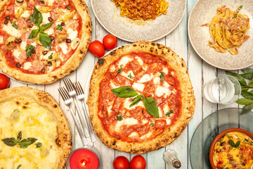 
Image of table full of Italian pizzas