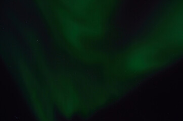 majestic aurora borealis on dark star filled night sky background