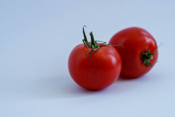 bright juicy tomatoes, cherry tomatoes on a white background