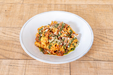Pomodoro pasta dish on wooden table