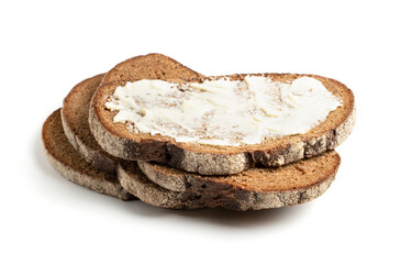 A slice of black rye bread spread with butter on a white background. Isolated object, a concept for culinary design.