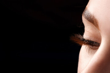 Beautiful macro woman's eye with extremely long lashes and natural makeup.