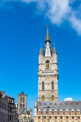 Towers with gilded ornaments and clock of  Saint Bavo  Cathedral in Ghent, Belgium