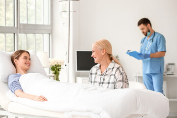 Fototapeta premium Mother visiting her daughter in hospital