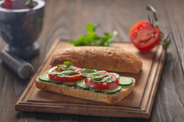 Sandwich with vegetables and eggs, vegetables and greens