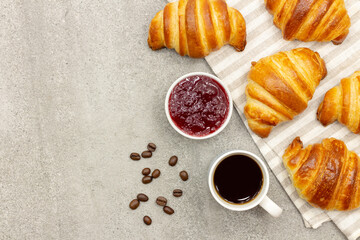 Breakfast with croissant, coffee and jam