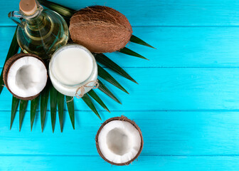 coconut oil and coconut on a blue background