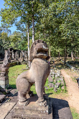Fototapeta na wymiar Stone Statue at the South Bayon Gate to Bayon Temple at the Angkor Wat Complex Near Siem Reap Cambodia
