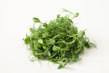 Young sprouts of peas, micro greens on white background. Healthy eating concept.