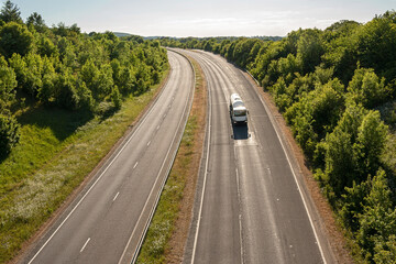 British road transport. Single lorry in motion on empty motorway