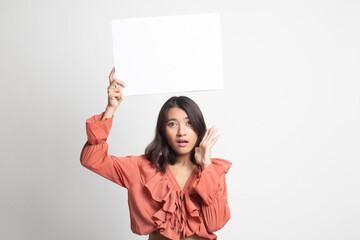 Young Asian woman surprise with white blank sign .