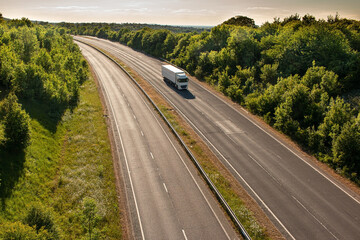 British road transport. Single lorry in motion on empty motorway