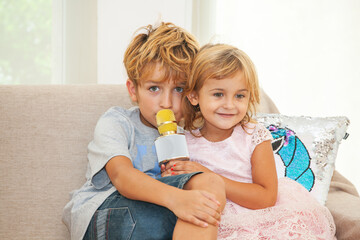 Brother and sister singing in karaoke on a holiday