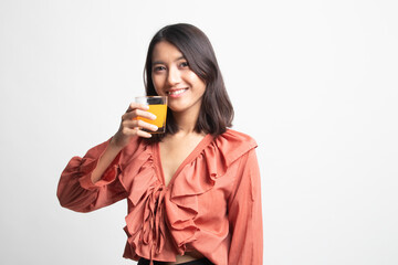 Young Asian woman drink orange juice .