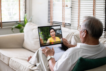 Asian old senior video call virtual meeting with family