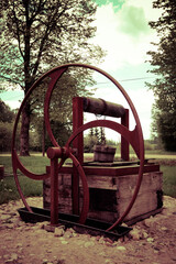 Fototapeta na wymiar old rusty wheel in the park