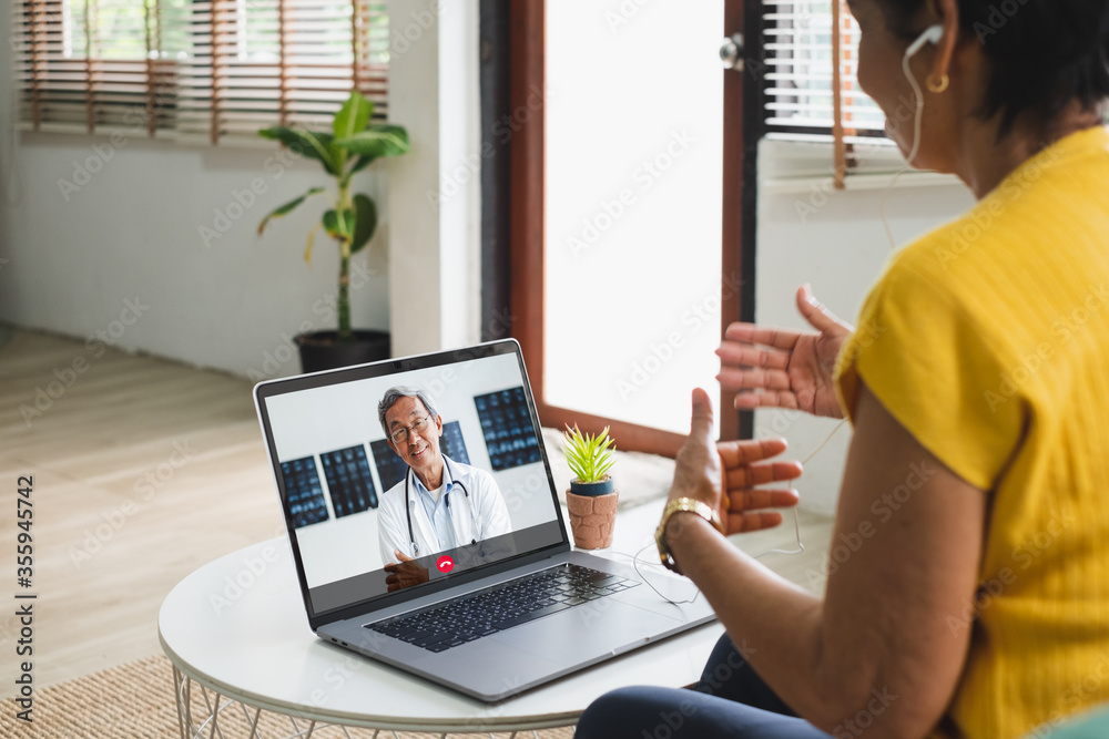 Wall mural asian senior video call with doctor telemedicine telehealth concept