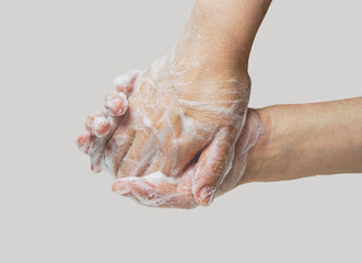 Fototapeta premium Washing hands with soap, hands in foam