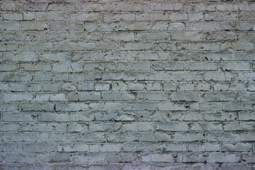 
Gray brick wall. A large plot is shown, the texture of the masonry is visible