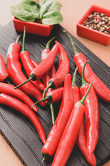 Hot chili pepper on wooden board