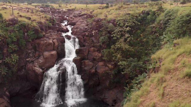 Aerial drone view of flying towards Kondwal Waterfall, Maharashtra, India.