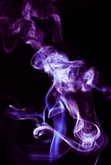 purple colored smoke on a black background