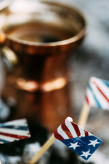 Three paper flags of America. 4th of July. Coffee.