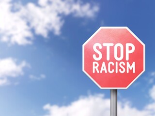 Stop racism - Road sign on blue sky background