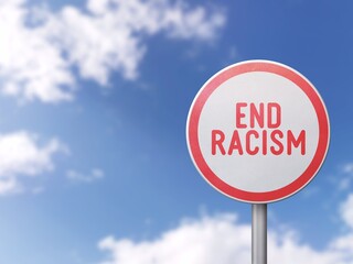 End racism - Road sign on blue sky background