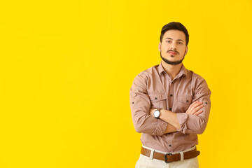 Handsome young man on color background