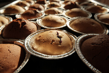Warm cupcakes with chocolate and berries fresh from the oven