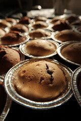 Warm cupcakes with chocolate and berries fresh from the oven