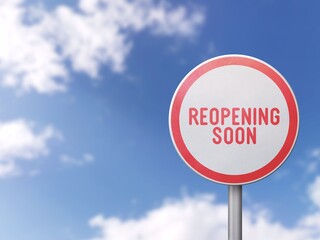 Reopening soon - Road sign on blue sky background