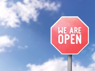 Obraz premium We are open - Road sign on blue sky background