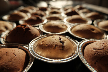 Warm cupcakes with chocolate and berries fresh from the oven