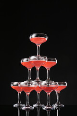 Champagne tower on dark background