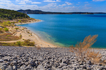 Canyon Lake close to San Antonio, New Braunfels, San Marcos and Wimberley in the Texas hill country. It is part of the Guadalupe River. You can walk on the dam. There are many beaches on the shores. - Powered by Adobe